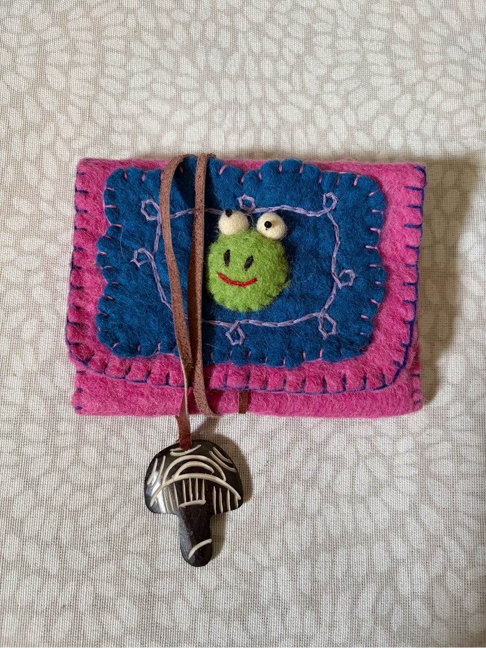 Handmaid Boiled-wool cardholder with frog and mushroom wrap